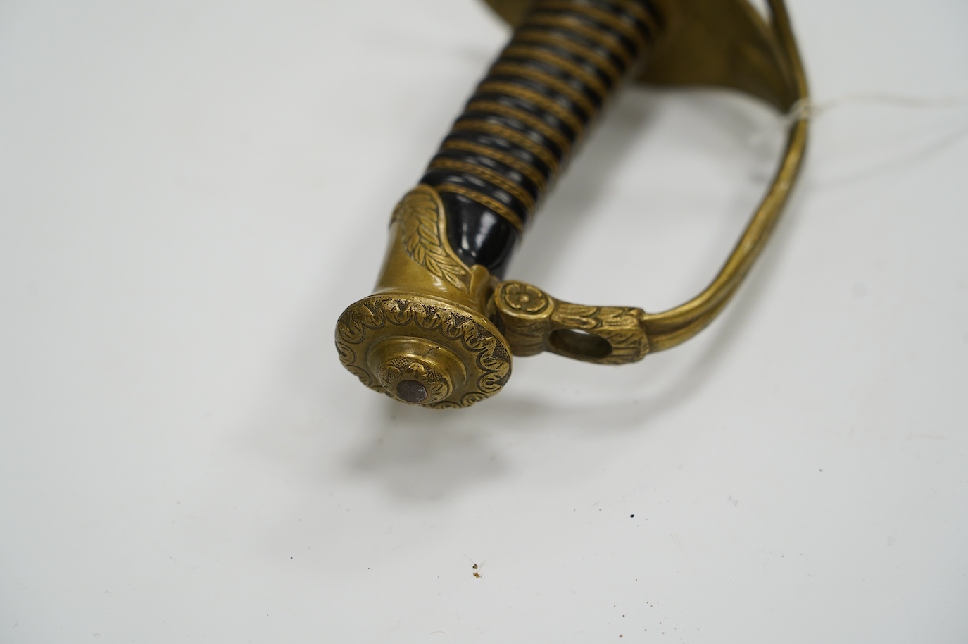 A Belgian WWI infantry officer’s pipeback sword, blade etched with crowned A ‘Albert I’ and ‘Pour le Roi et la Patrie’ with regulation brass hilt, blade 74.5cm. Condition - good